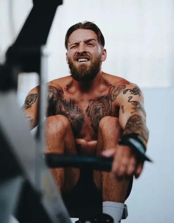 Man rowing at hyrox class